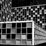 Black and white photo of the exterior of the International Criminal Court (ICC) in The Hague, symbolising global justice, accountability, and international law. Photo by Anemoontjes via Flickr (CC BY-ND 2.0)
