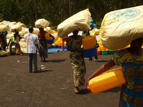 Women leave the distribution center carrying essential nonfood supplies. Photo: Concern Worldwide.