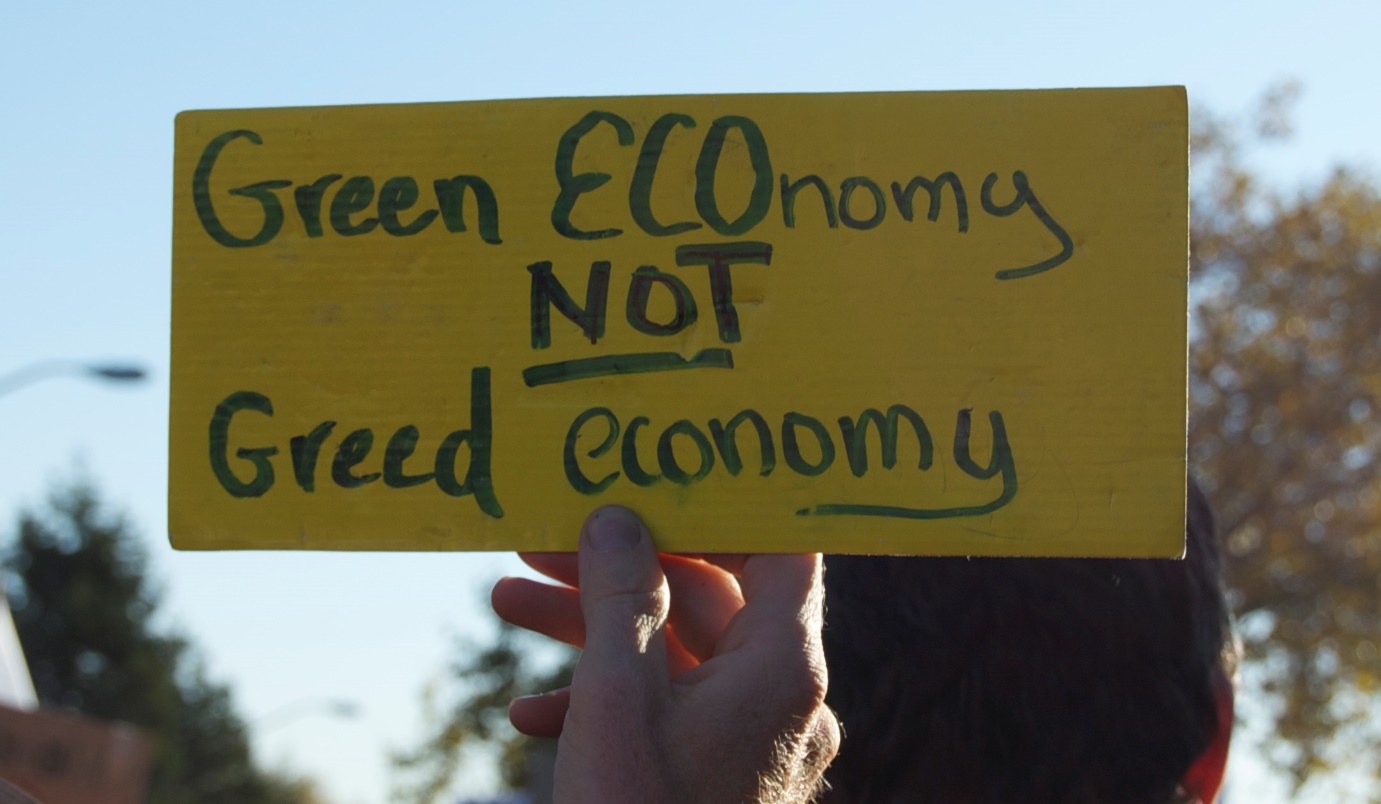 Photo: green ECOnomy not greed economy by Lily Rhoads (Oct 31, 2011). CC BY-2.0 license via Flickr.